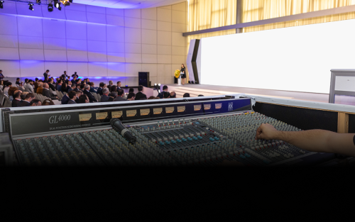 sound-operator-working-with-remote-control-conference 1